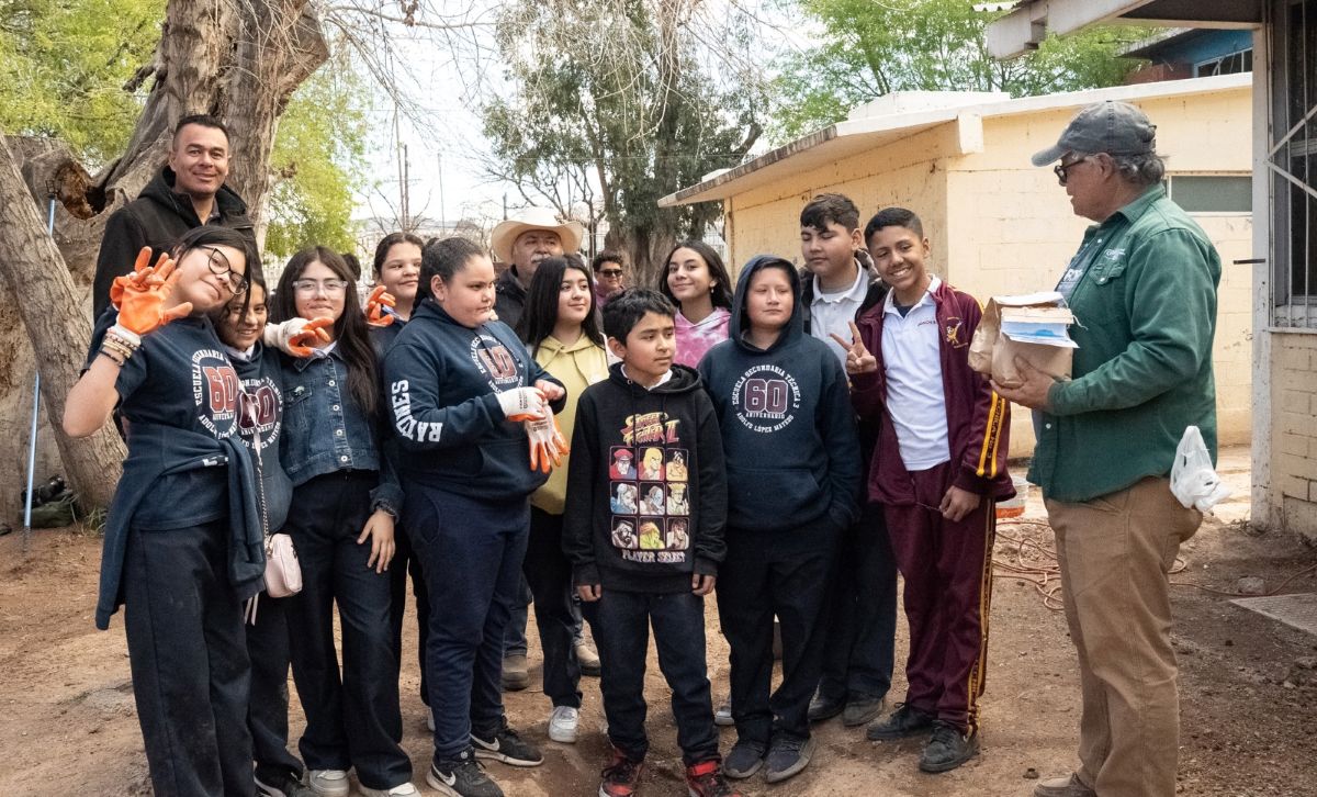 a group of students, their teacher, and WMG staff Joaquin standing outside a school in Sonora