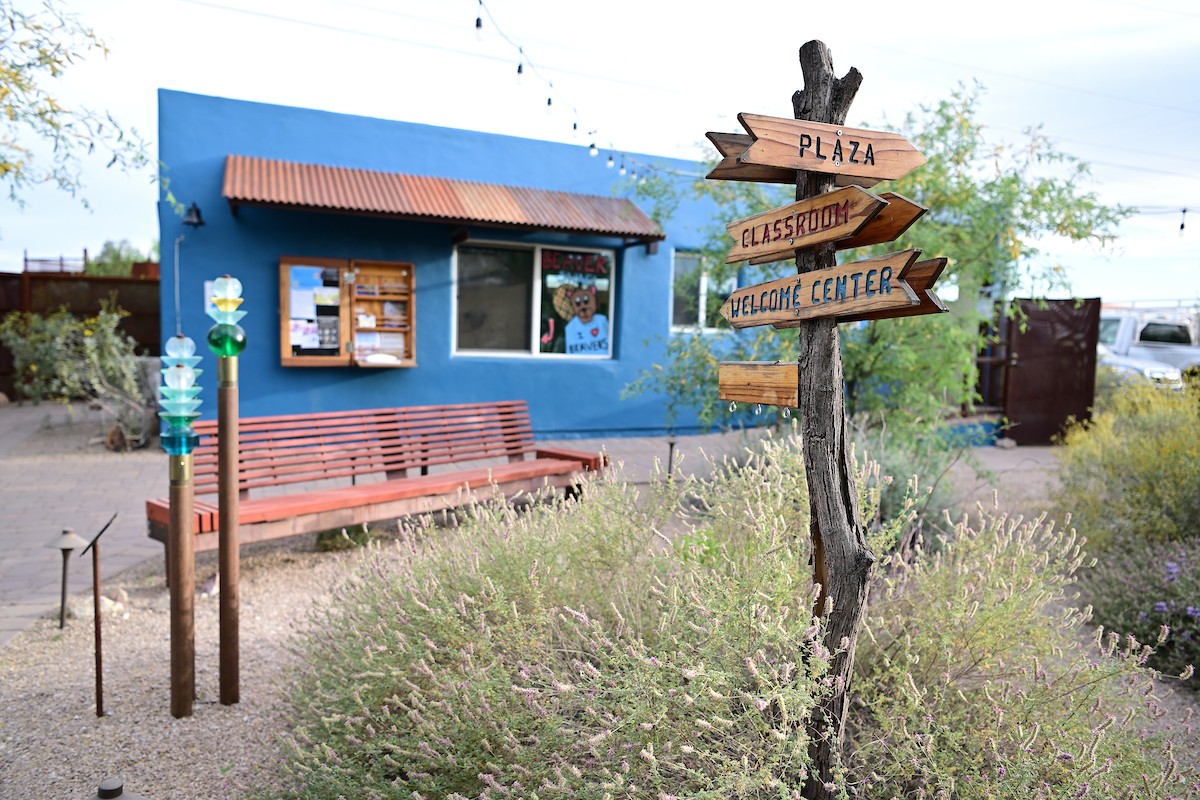 The Welcome Center at the Living Lab with signs directing visitors to different areas