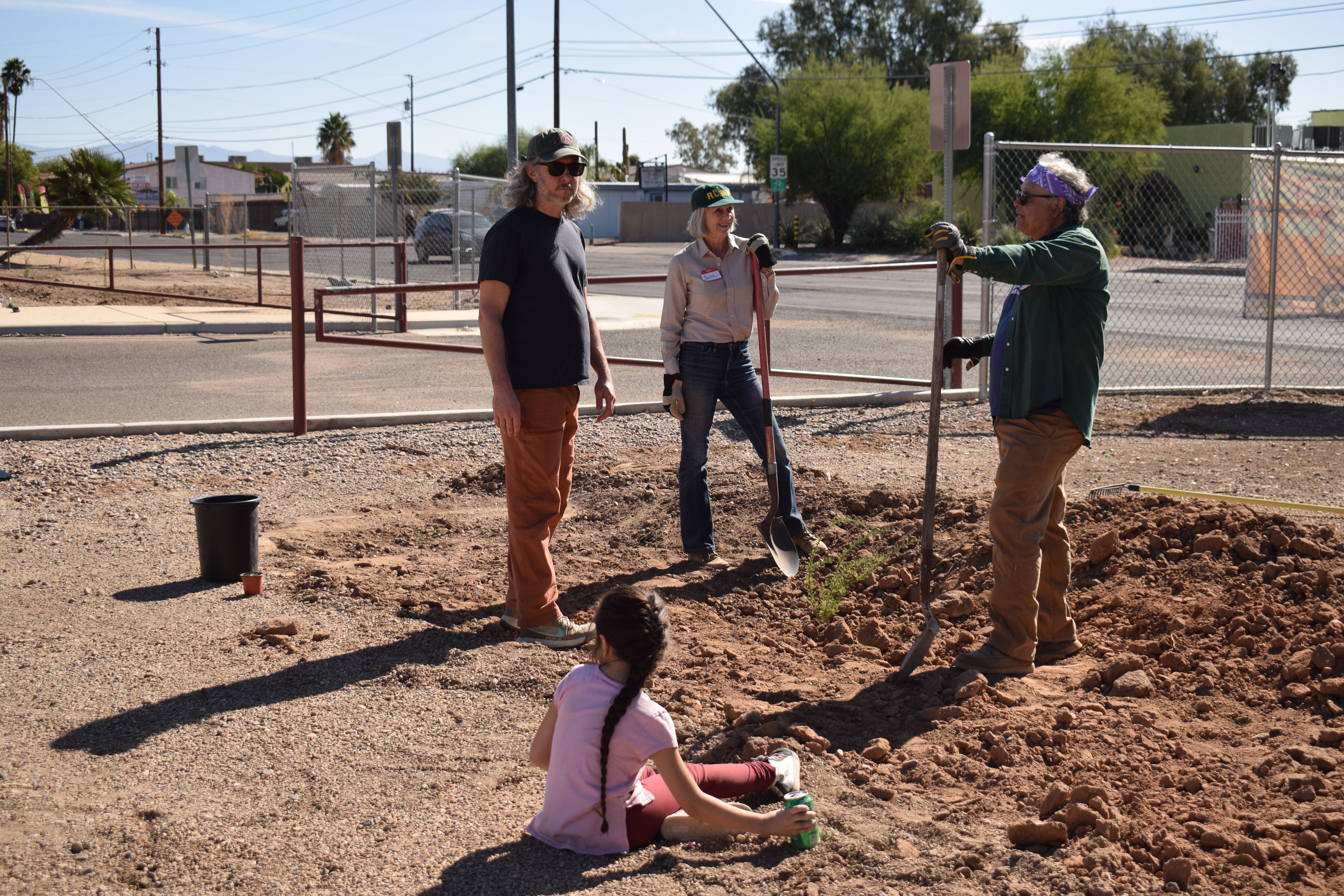 Students and community volunteers build a rain garden at Prince Elementary. 