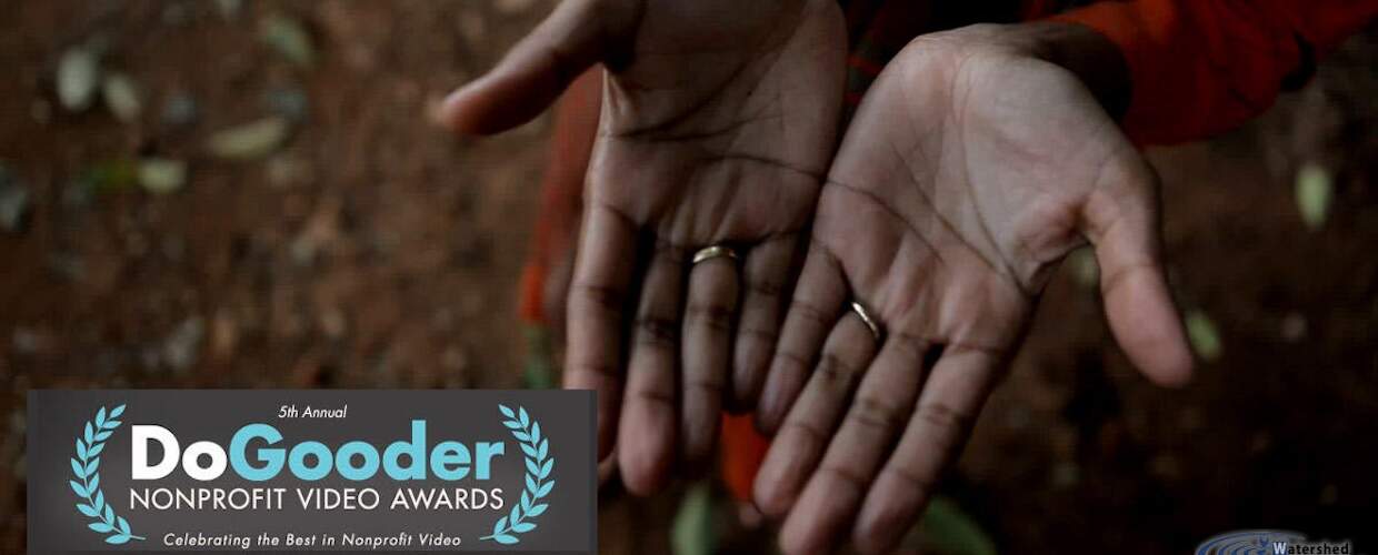 a pair of hands held upwards facing the camera