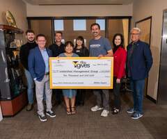 WMG receives a $10,000 check from TFCU 